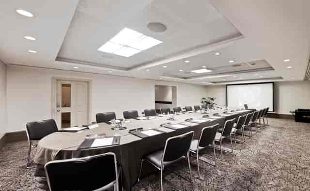 Langham Suite meeting room with oval table, ideal for corporate events and workshops.
