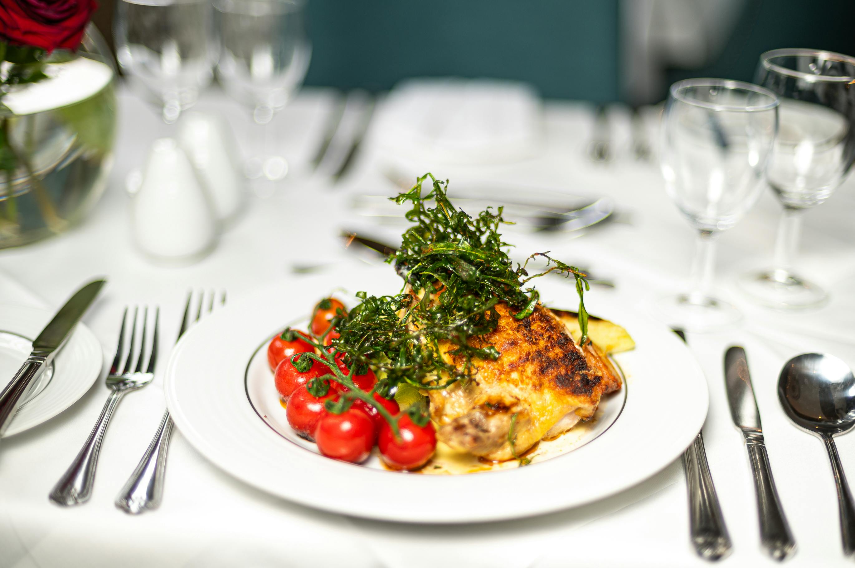 Elegant chicken dish with herbs at Gem Strathmore Hotel for corporate events.