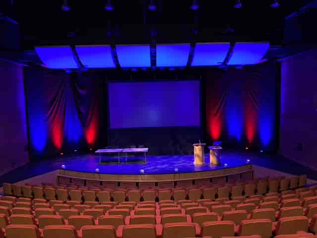 Marden Park Mansion event space with stage and professional lighting for conferences.