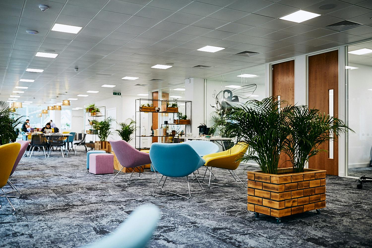 Modern open office lounge with vibrant seating for collaboration and networking events.