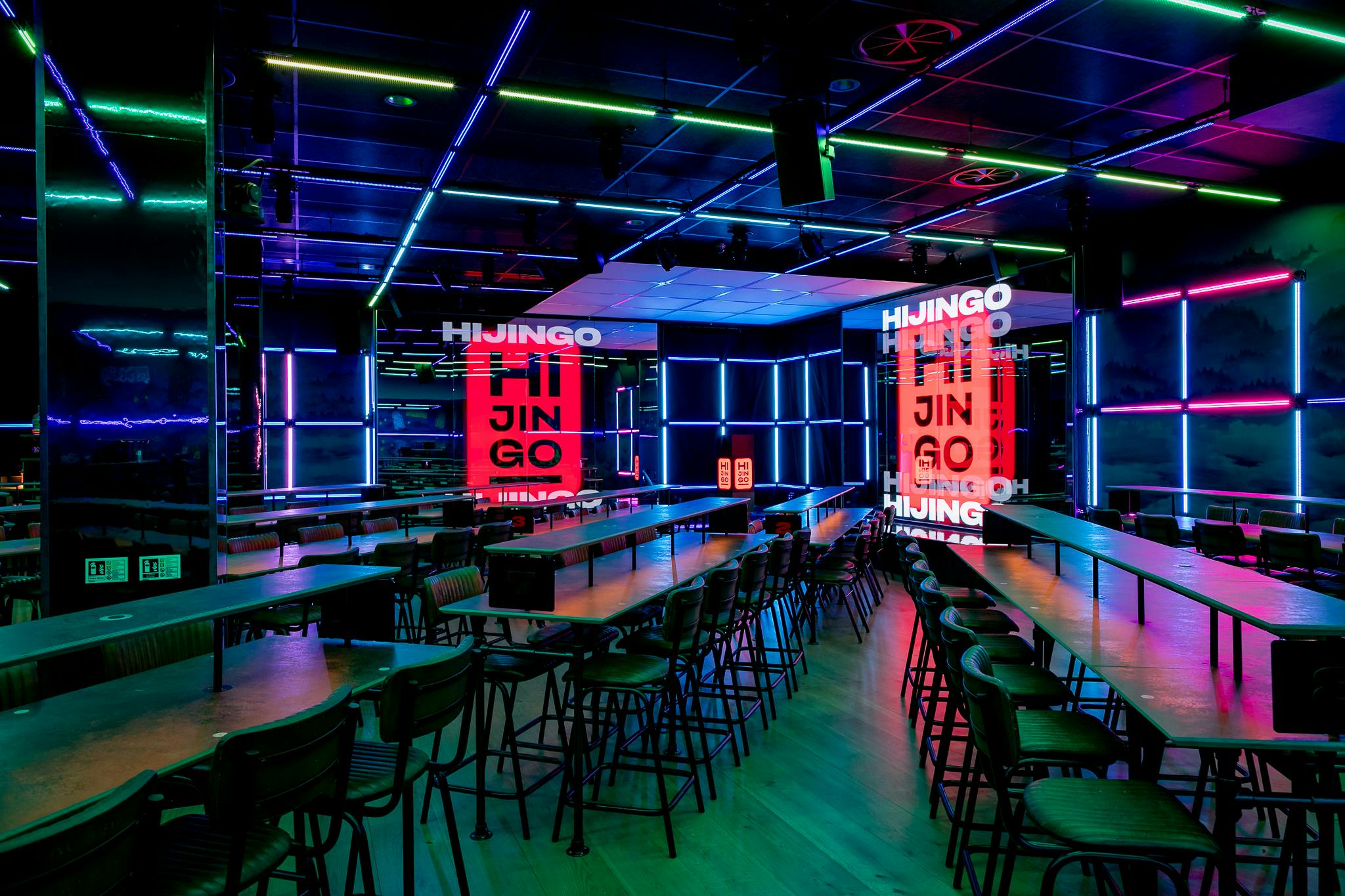 Modern event space in Hijingo with vibrant neon lighting for tech-savvy gatherings.