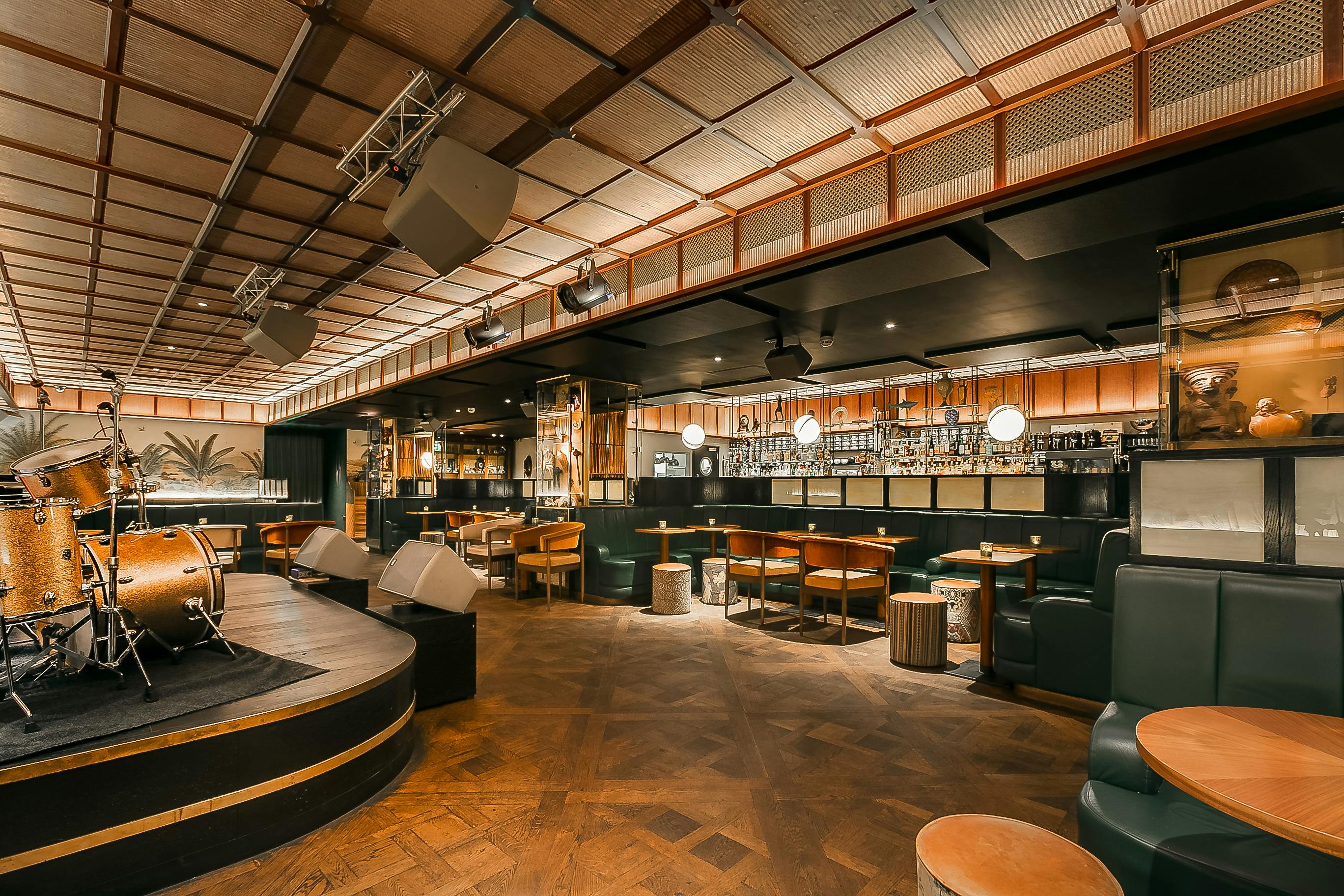 Stylish Oriole Bar venue with warm lighting for intimate events and live performances.