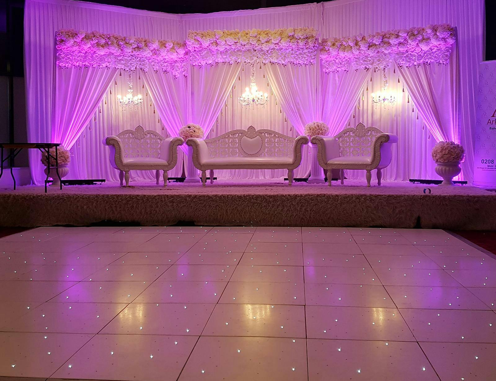 Elegant Main Hall at The Ark Royal, featuring floral decor for weddings and upscale events.