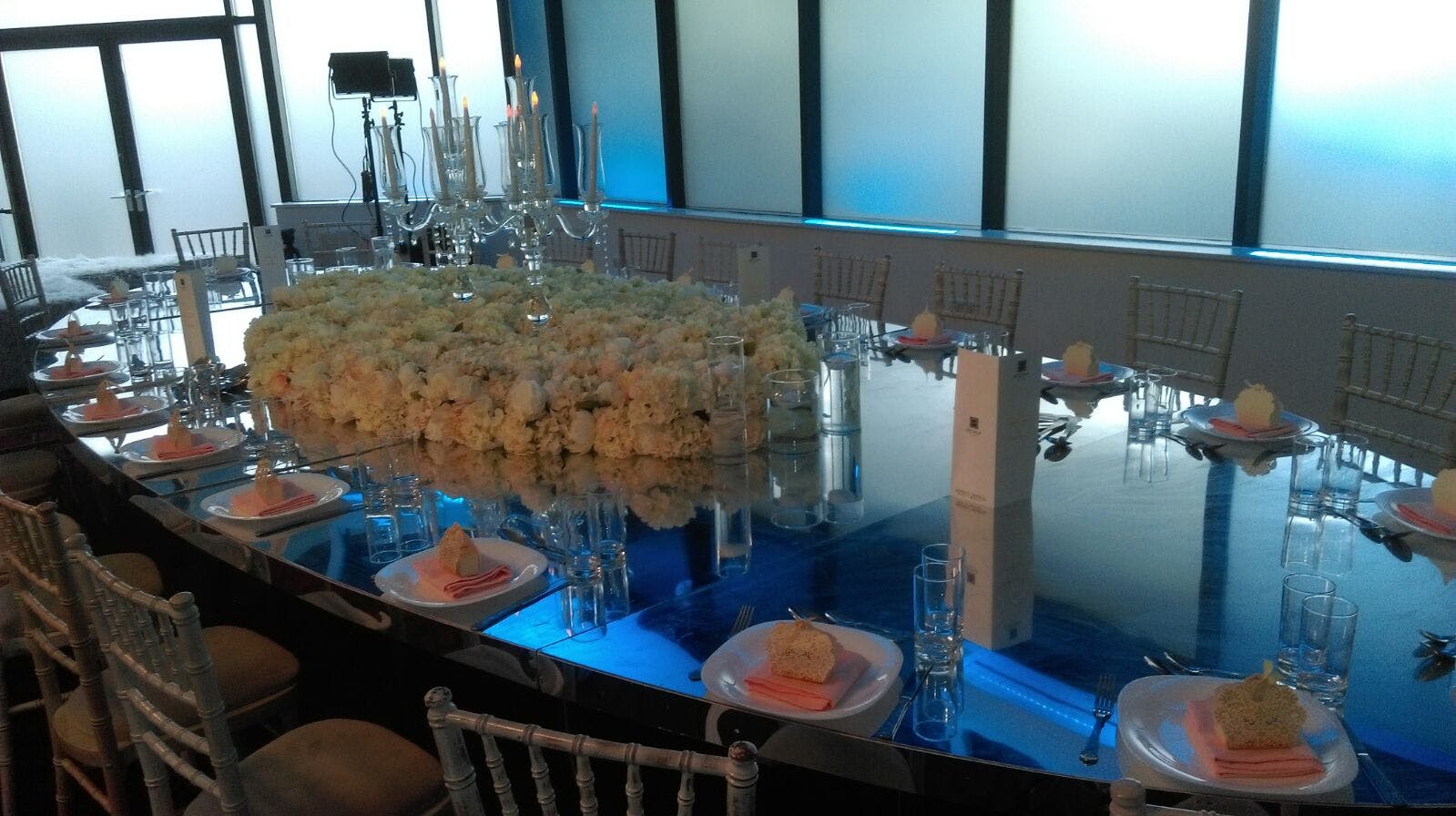 Elegant dining table with floral centerpiece for upscale corporate event in The Ark Royal.