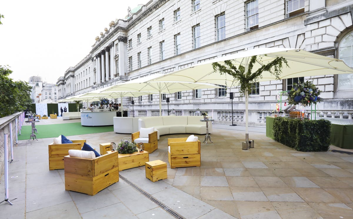 Stylish outdoor event space at Somerset House with modern seating and umbrellas.