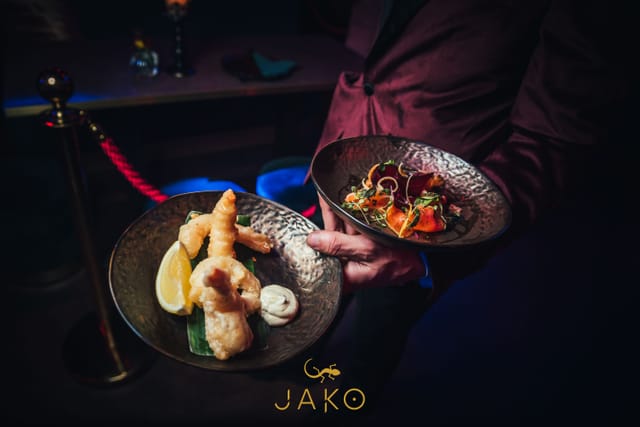 Sophisticated lounge area catering setup with elegant dishes for upscale events in Jako London.