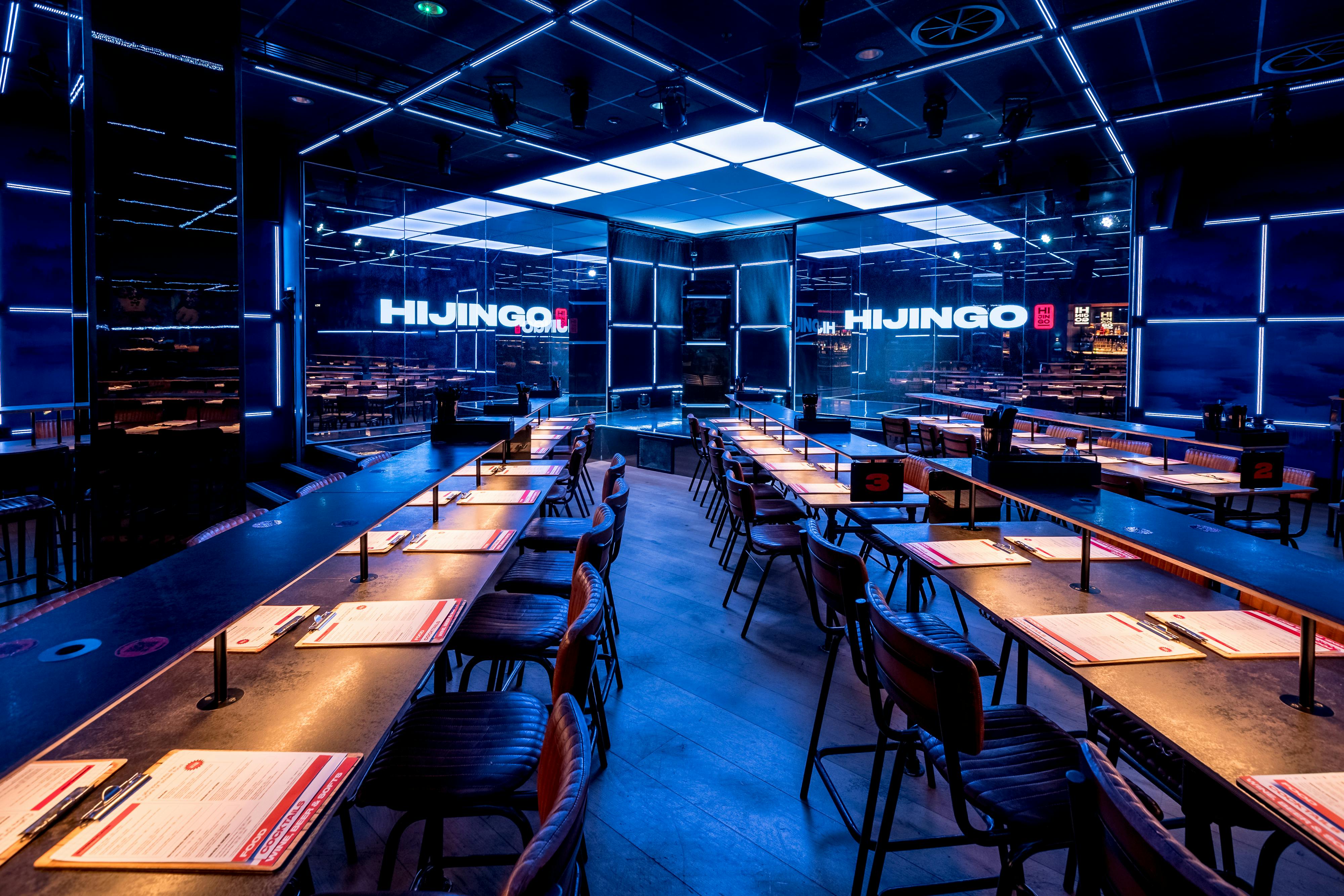 Modern event space at Hijingo with communal table for interactive dining experiences.
