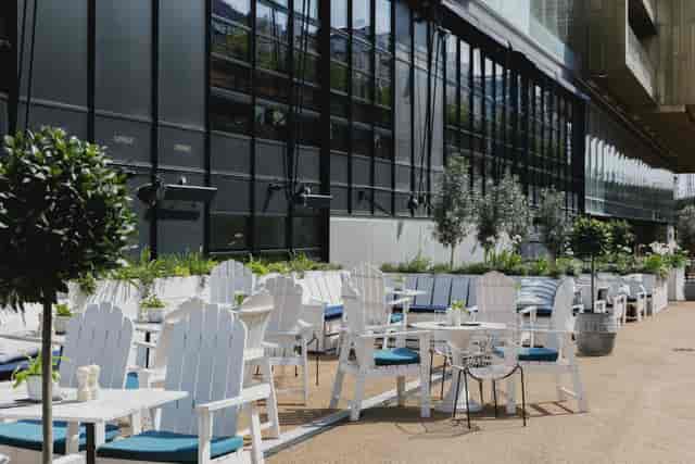 Stylish outdoor event space with Adirondack chairs at No.29 Power Station West.