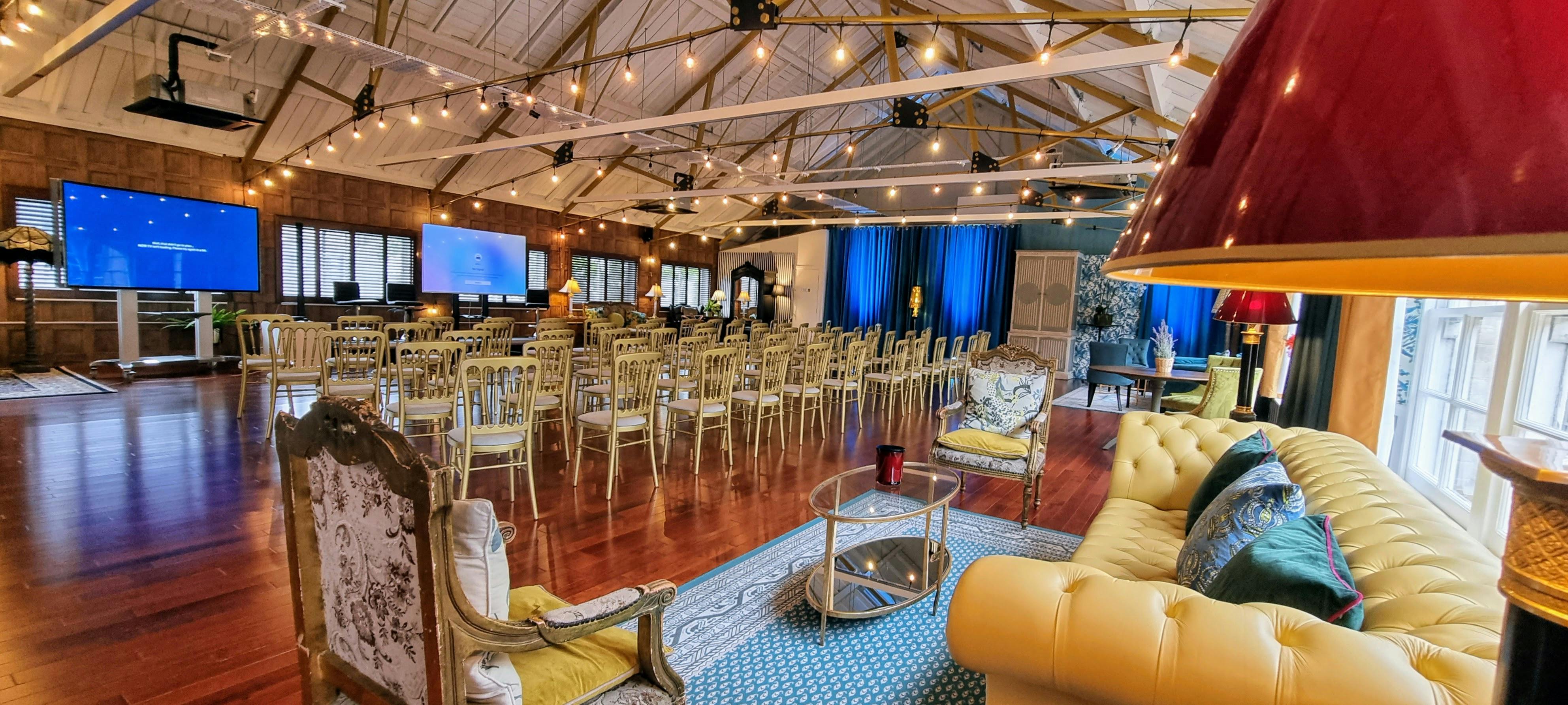 Elegant event space with gold chairs for banquets and networking in Lumiere Underwood.