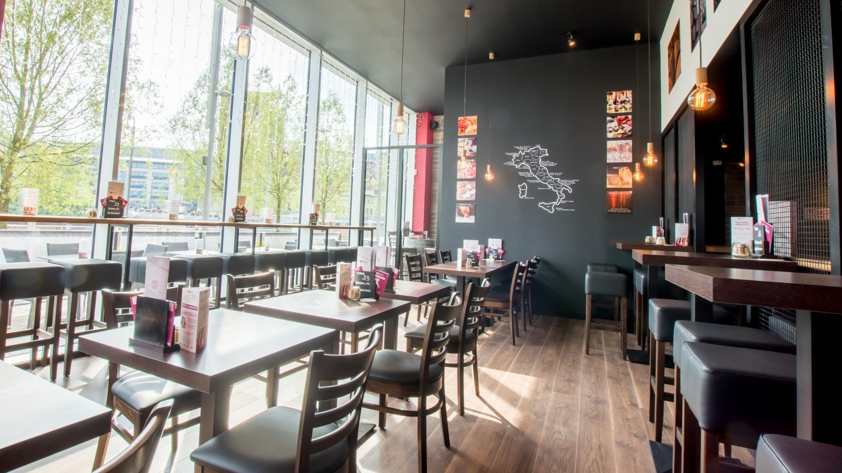 Modern dining space at Veeno Italian Wine Bar, ideal for casual meetings and events.