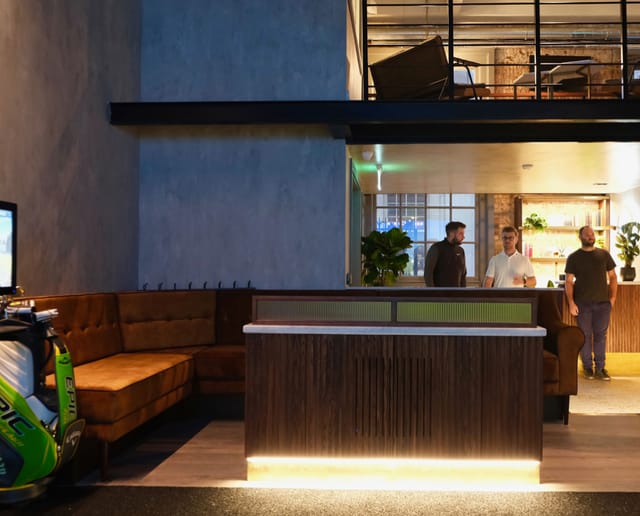 Modern event venue with natural light, ideal for meetings and networking.
