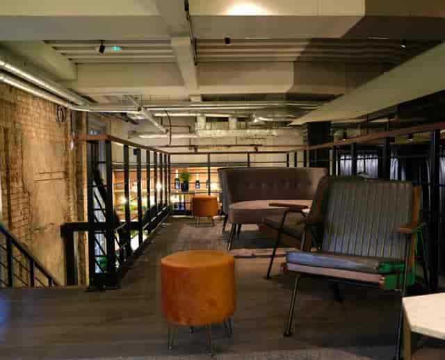 Modern meeting space with industrial design for informal gatherings at Exclusive Venue.