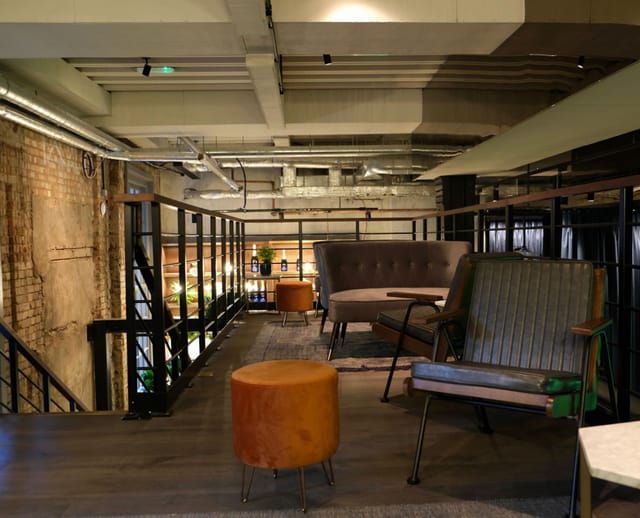 Modern meeting space with industrial design for informal gatherings at Exclusive Venue.