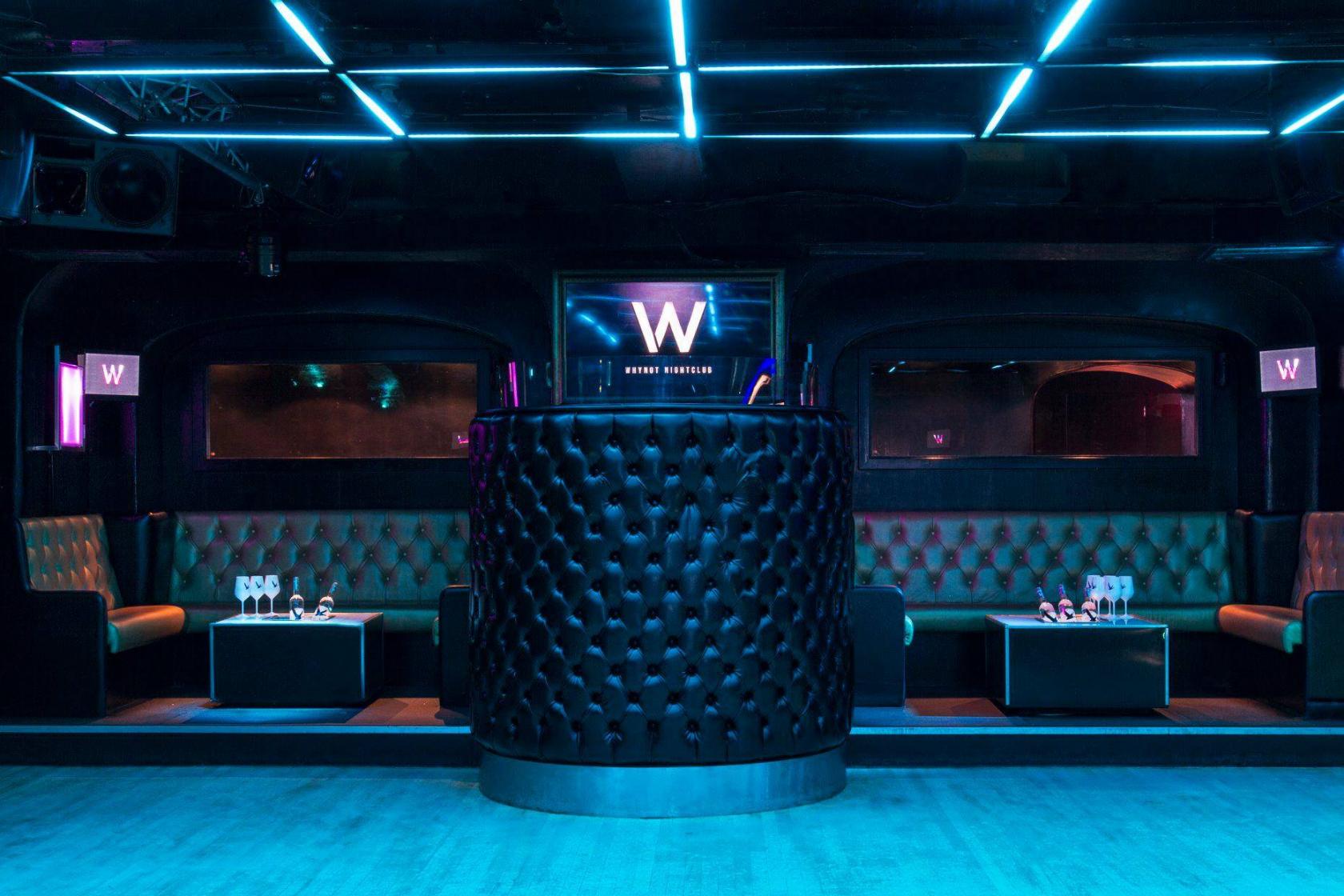 Whole Venue at Why Not Nightclub: modern event space with vibrant blue lighting for parties.