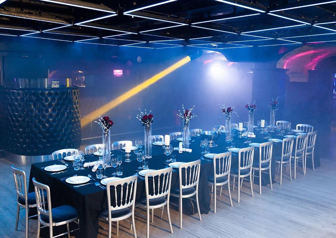 Elegant dinner setup at Why Not Nightclub for corporate events and upscale gatherings.