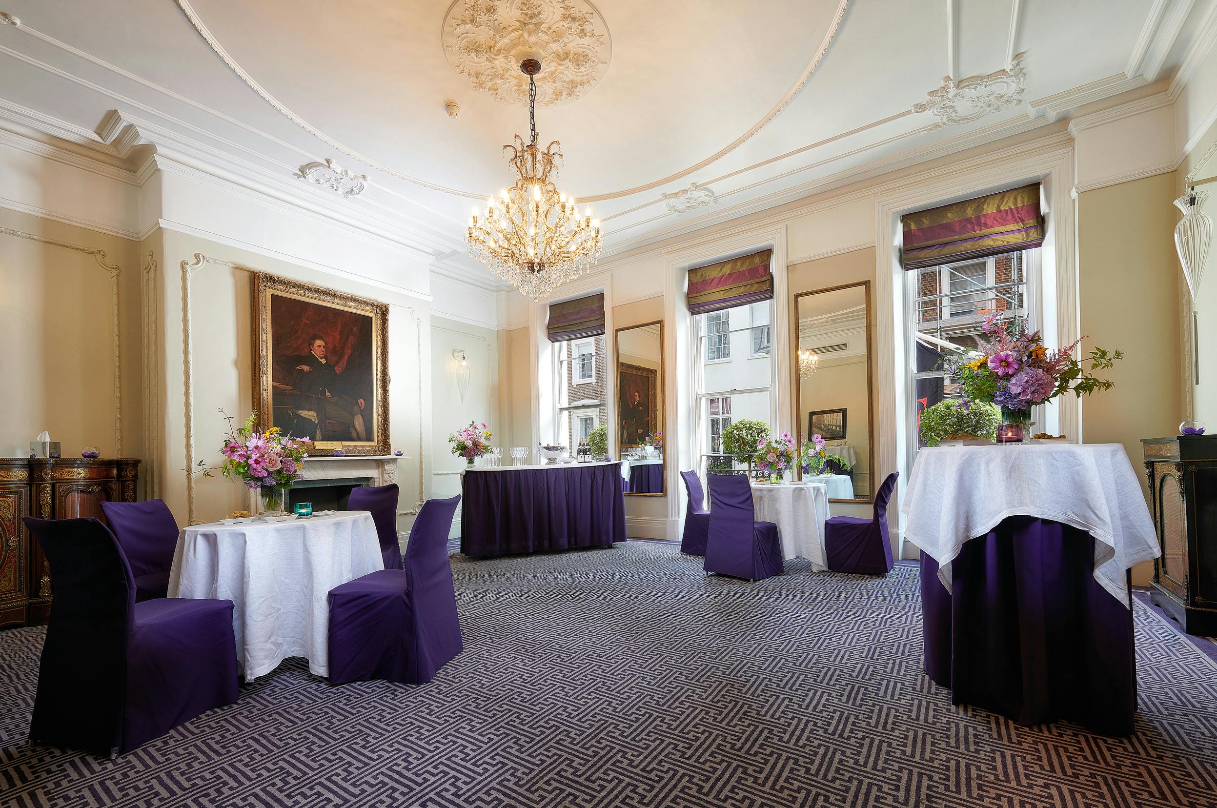Elegant event space in Brown's Hotel with purple accents, ideal for corporate meetings.