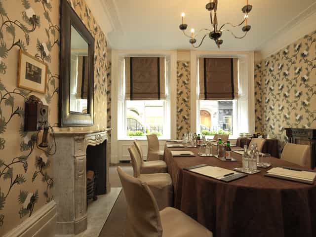 Graham Bell in a stylish meeting room at Brown's Hotel for corporate events.