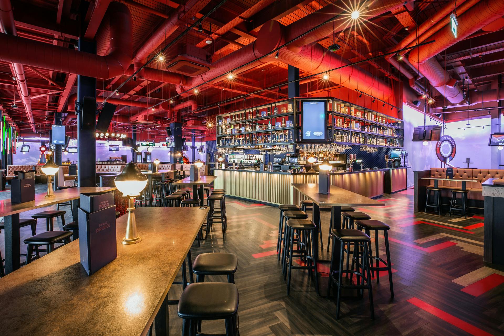 Vibrant event space at Puttshack Lakeside, ideal for networking and private parties.