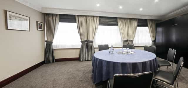 Syndicate Room at Fitzrovia Hotel, elegant meeting space for strategic discussions.