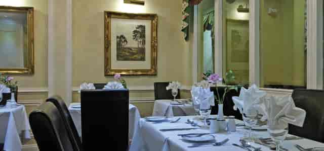 Elegant dining table in Syndicate Room, Fitzrovia Hotel for upscale events and dinners.
