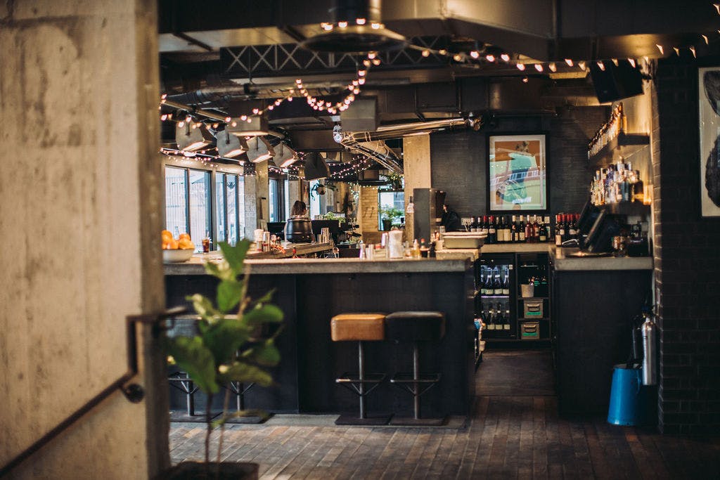 Stylish bar area in Heist Bank, ideal for networking events and informal meetings.