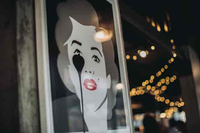 Stylized portrait art in vibrant Heist Bank venue for social events and networking.
