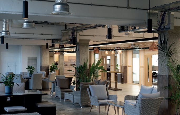 Modern open-concept meeting space with natural light for networking events and meetings.