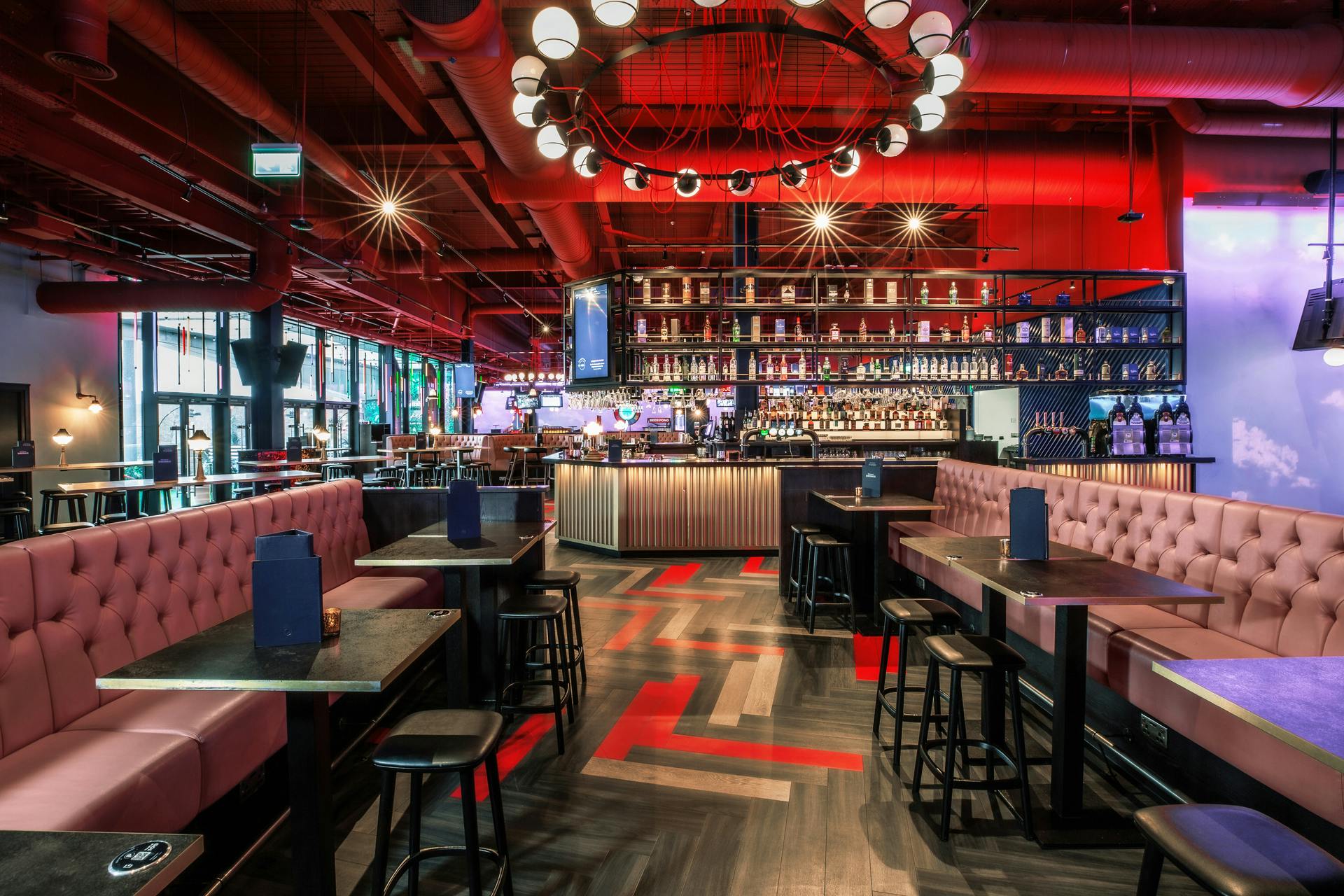 Modern event venue with vibrant decor for networking and social functions.