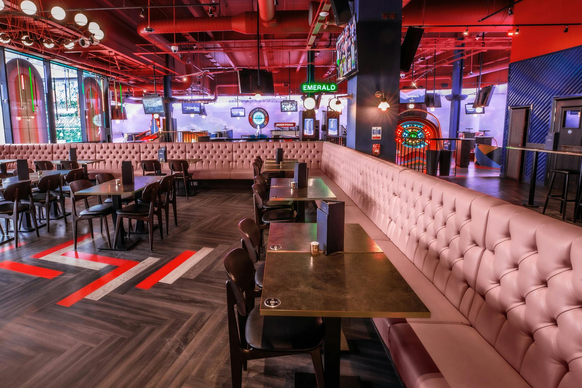 Modern event space at Puttshack Lakeside, ideal for corporate gatherings and networking.