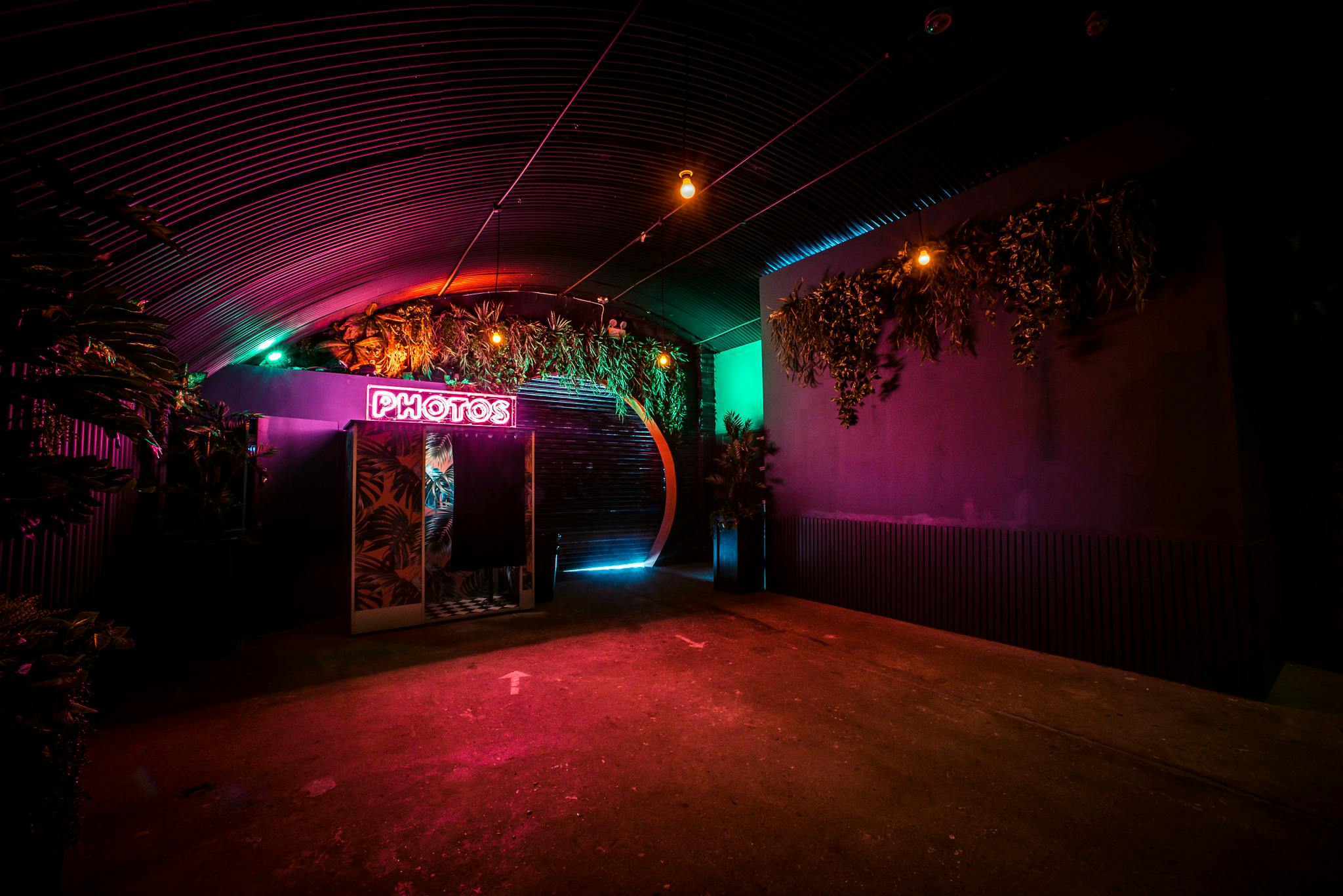 Vibrant Palm Bar at Night Tales, ideal for nightlife events and creative gatherings.