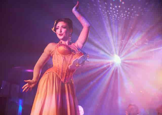 "Captivating performer in elegant costume at Phoenix Arts Club event"