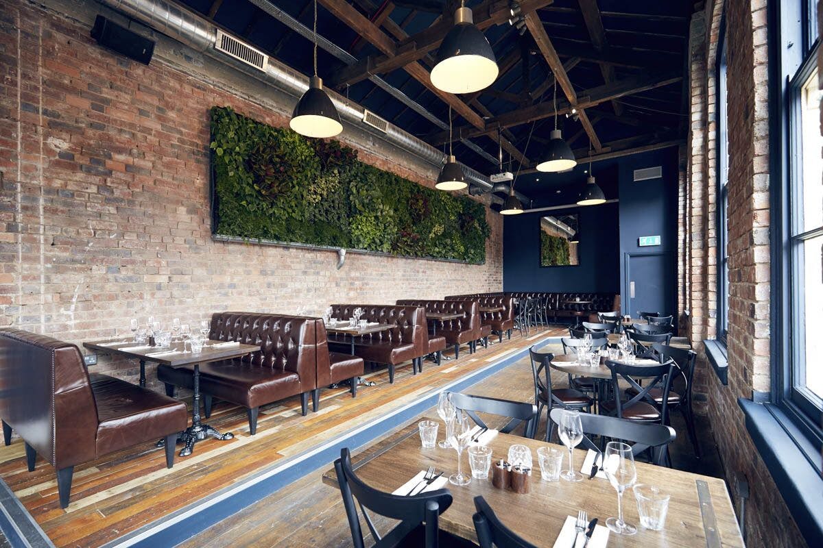 Stylish event space with exposed brick, ideal for networking events and private dinners.