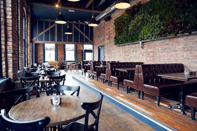 Stylish Upstairs Bar with rustic charm, ideal for events and gatherings.