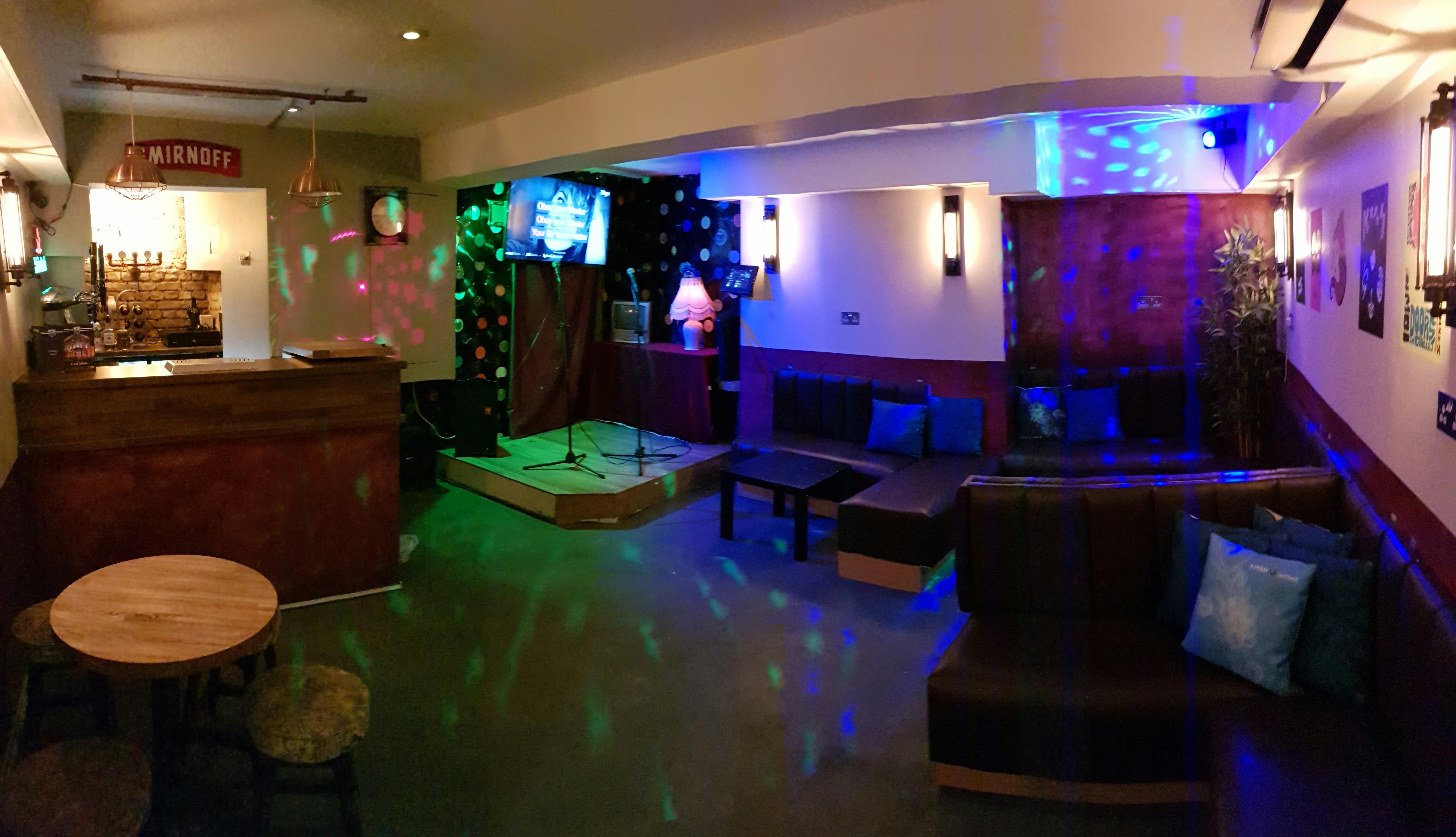 Cozy karaoke room at The Chelsea Pensioner, ideal for social events and team-building.