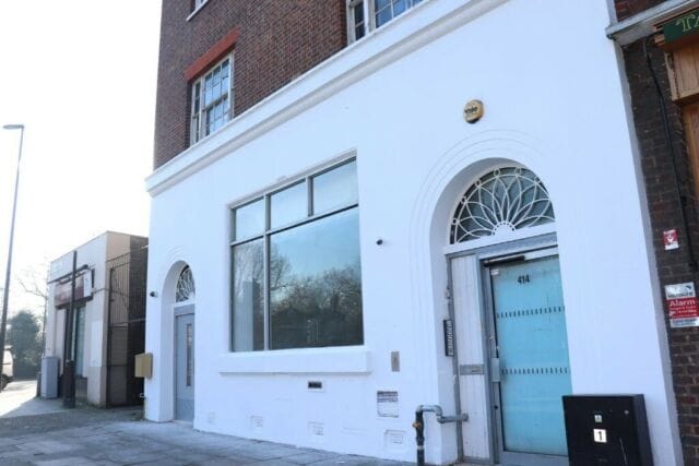 Modern event venue with large windows, ideal for meetings and social functions.