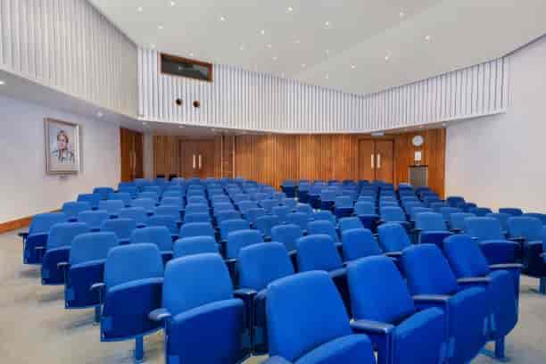 Lecture Theatre with blue seating, ideal for presentations and seminars at The Geological Society.