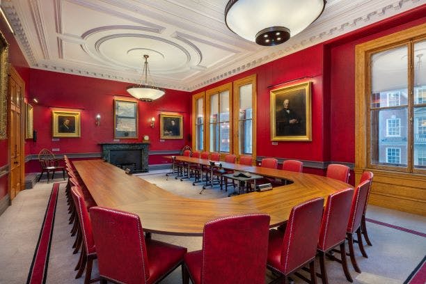 Council Room at The Geological Society, featuring rich red walls for meetings and events.