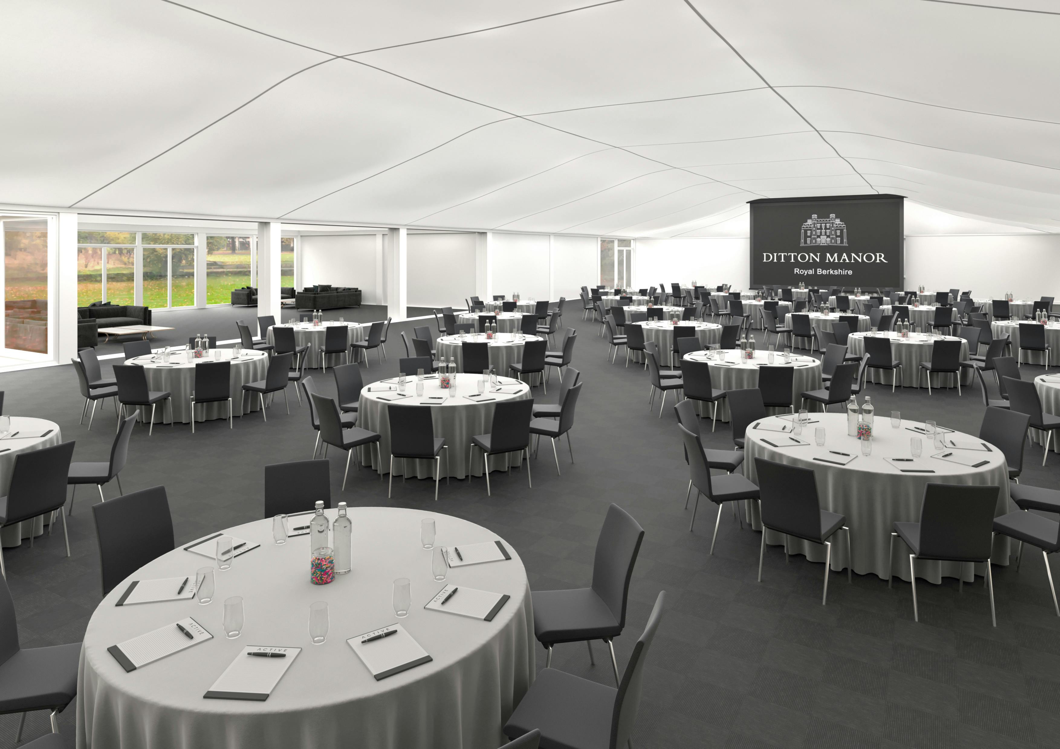 Elegant Ditton Manor Marquee with round tables for corporate events and weddings.