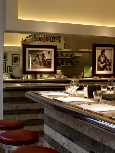 Private dining room at Barrafina Dean Street, elegant bar, ideal for upscale events.