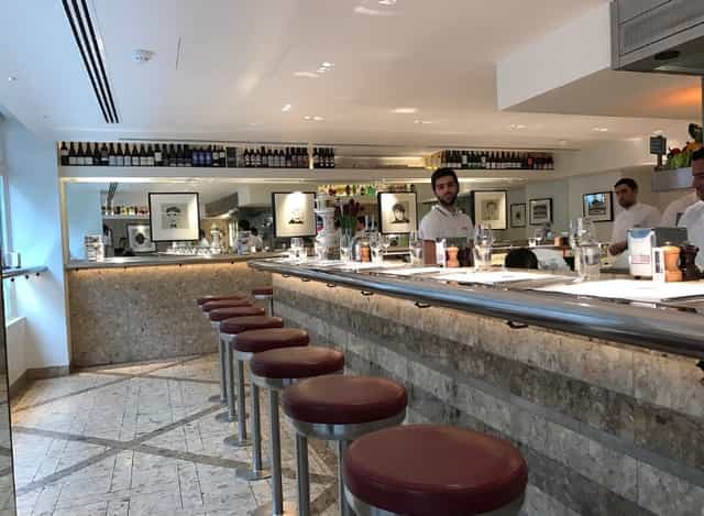 Private dining room at Barrafina Dean Street, modern bar ideal for networking events.