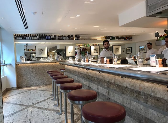 Private dining room at Barrafina Dean Street, modern bar ideal for networking events.
