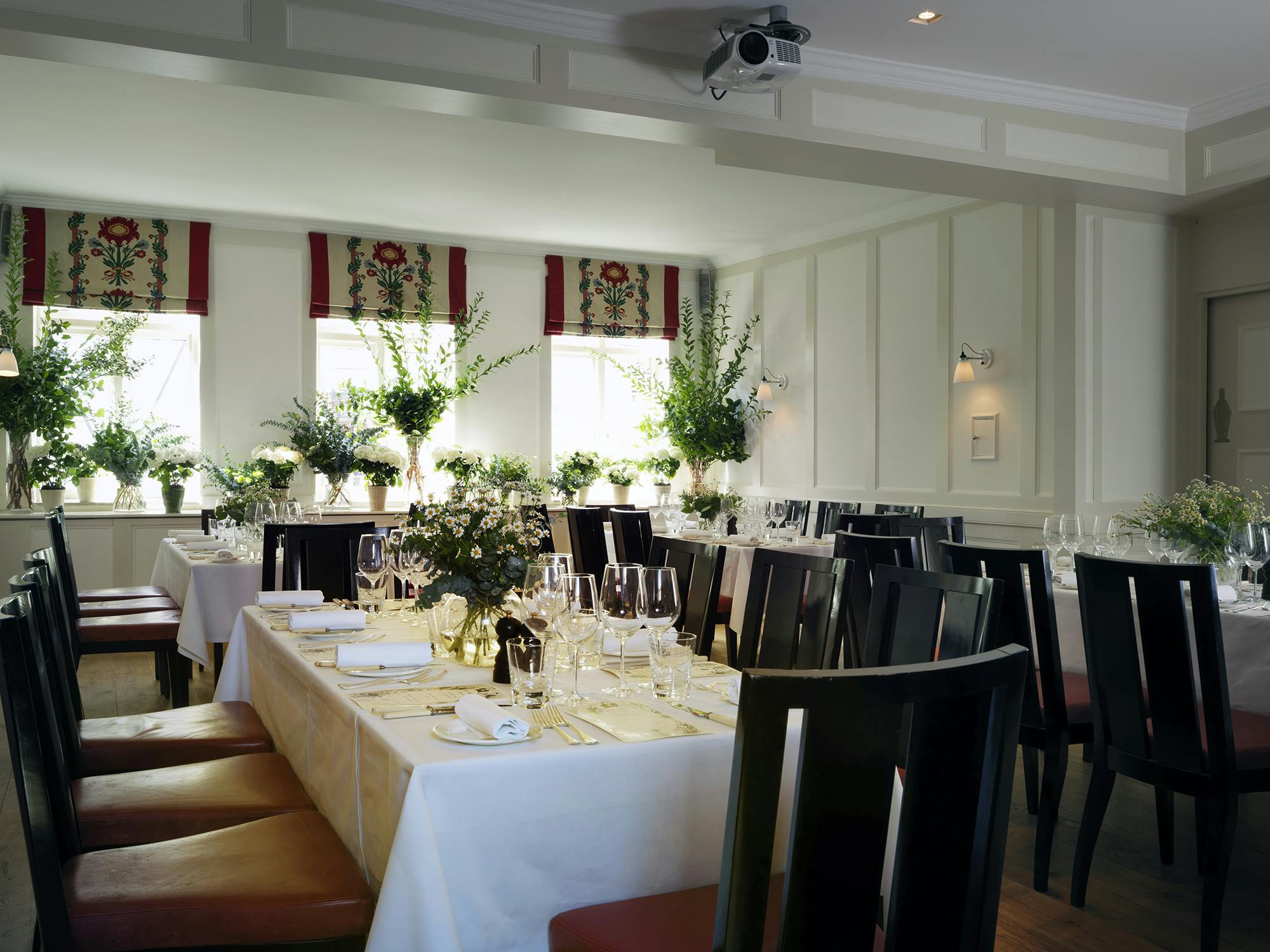 Elegant dining setup in The Marx Room, Quo Vadis for corporate events and gatherings.