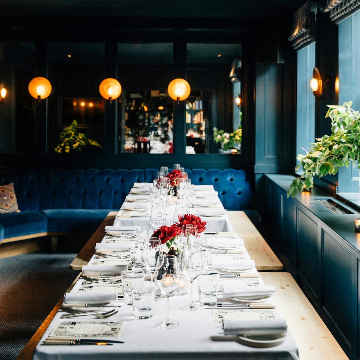 Elegant Blue Room dining setup for intimate events and corporate dinners.