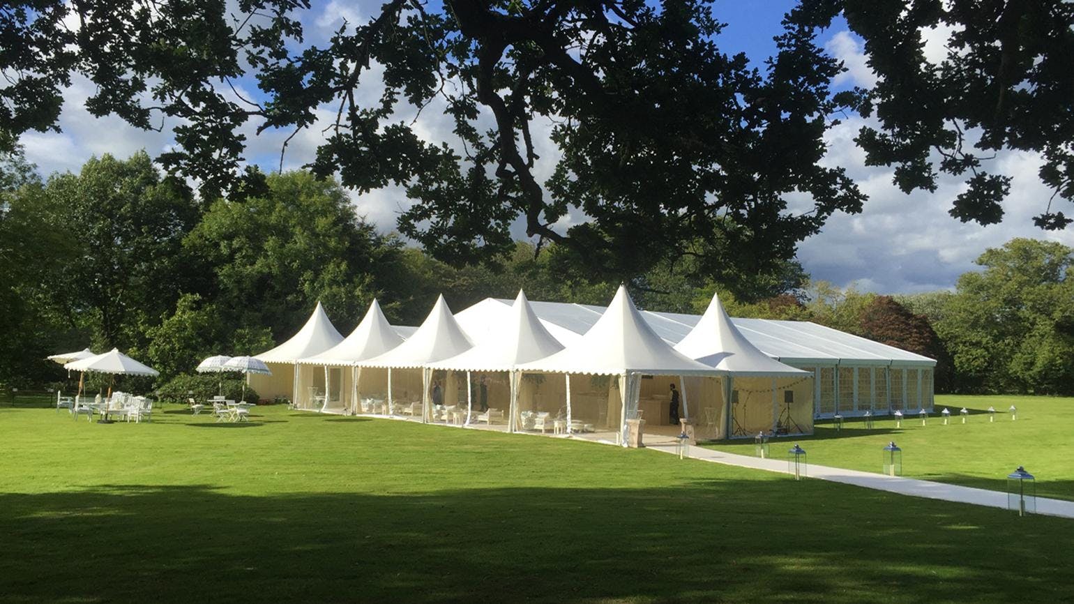 Elegant marquee on Croquet Lawn, Wakehurst, perfect for weddings and corporate events.