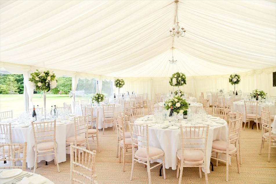 Elegant marquee setup on Croquet Lawn, Wakehurst for weddings and upscale events.