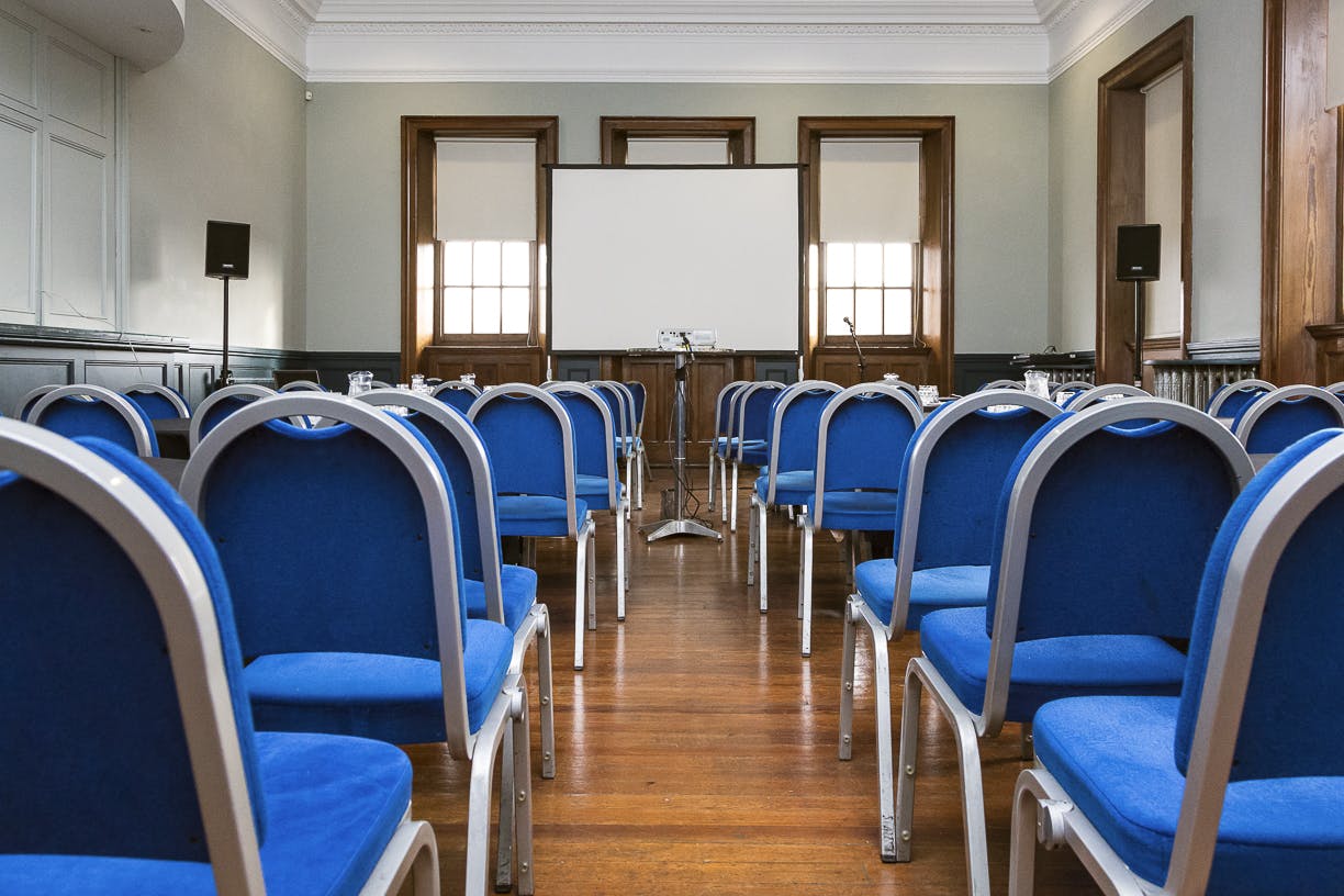 Newmart meeting space at O2 Academy Edinburgh with blue chairs for corporate workshops.