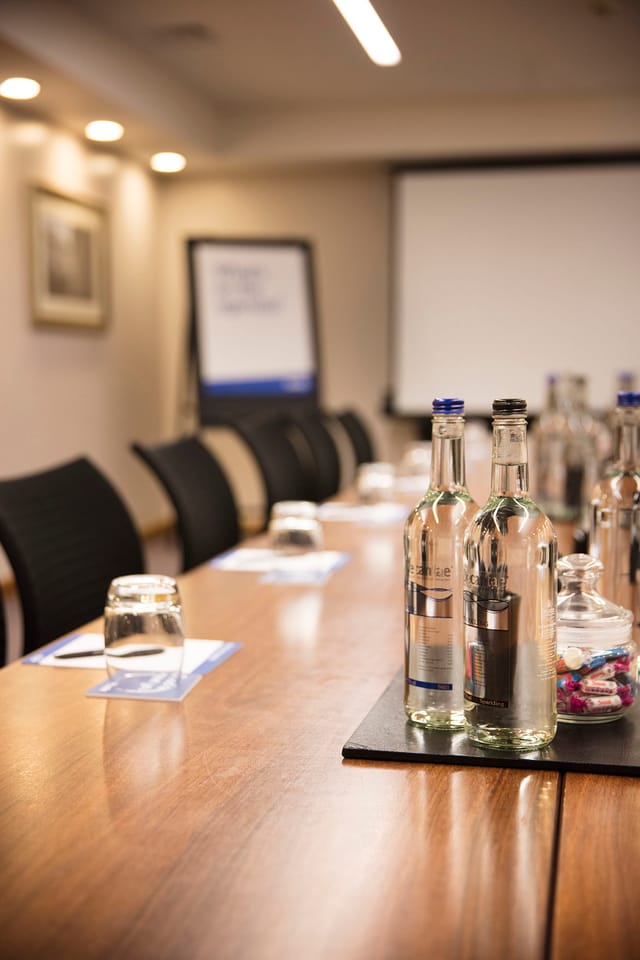Esmond meeting room with polished table, ideal for professional events and presentations.