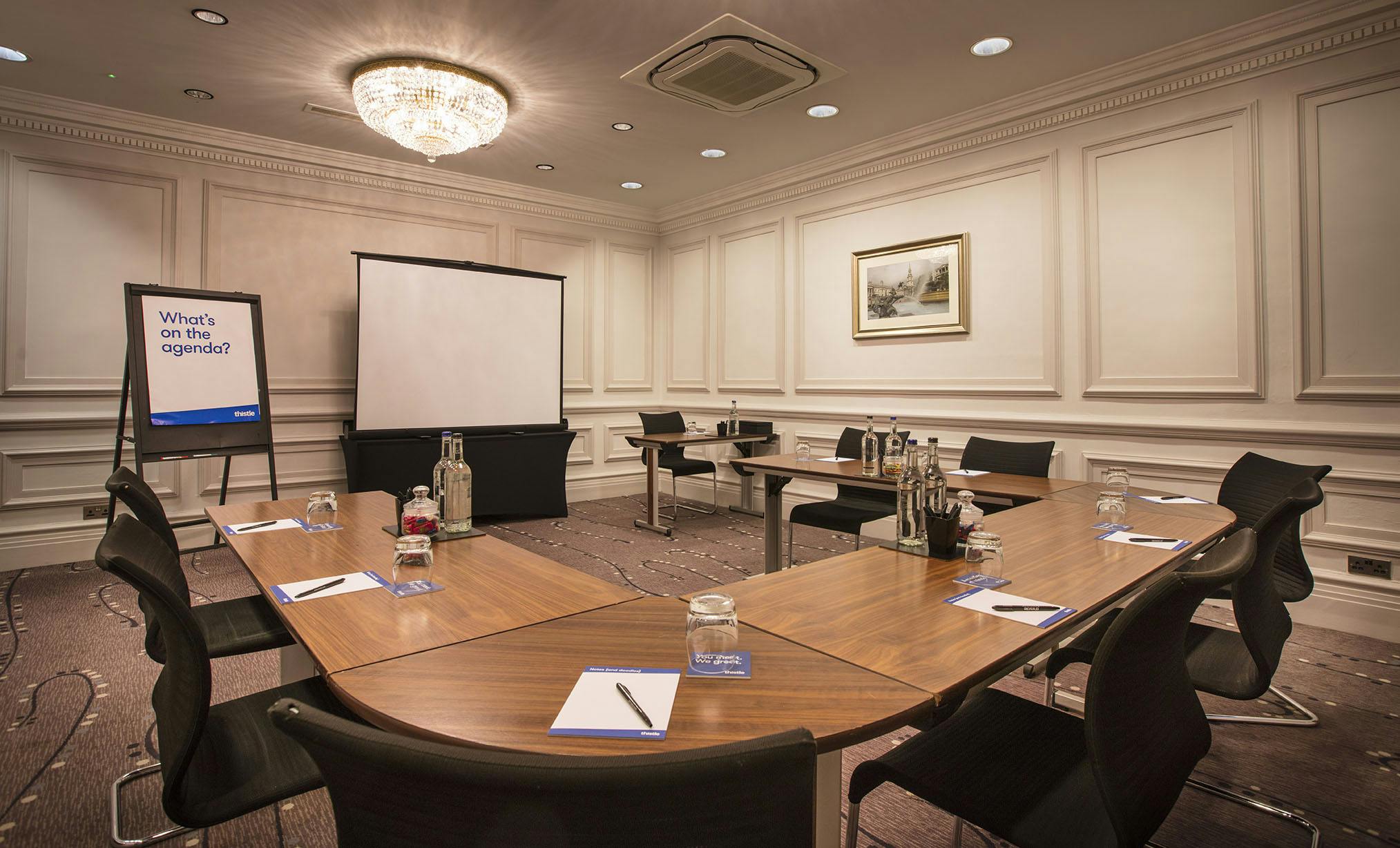 Esmond meeting room with U-shaped table, ideal for professional gatherings and presentations.