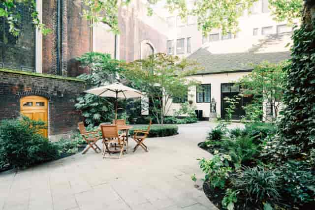 Summer party venue with garden seating for corporate retreats and team-building events.