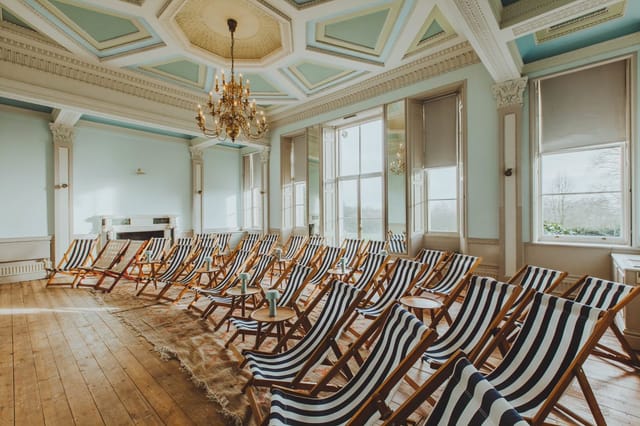 Stylish meeting space with striped deck chairs for creative workshops and brainstorming sessions.